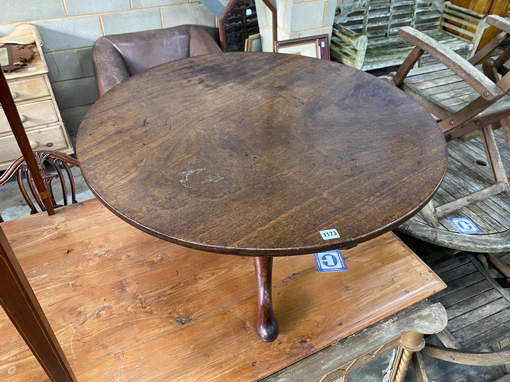 A George III circular mahogany tripod tea table, cut down, diameter 92cm, height 52cm